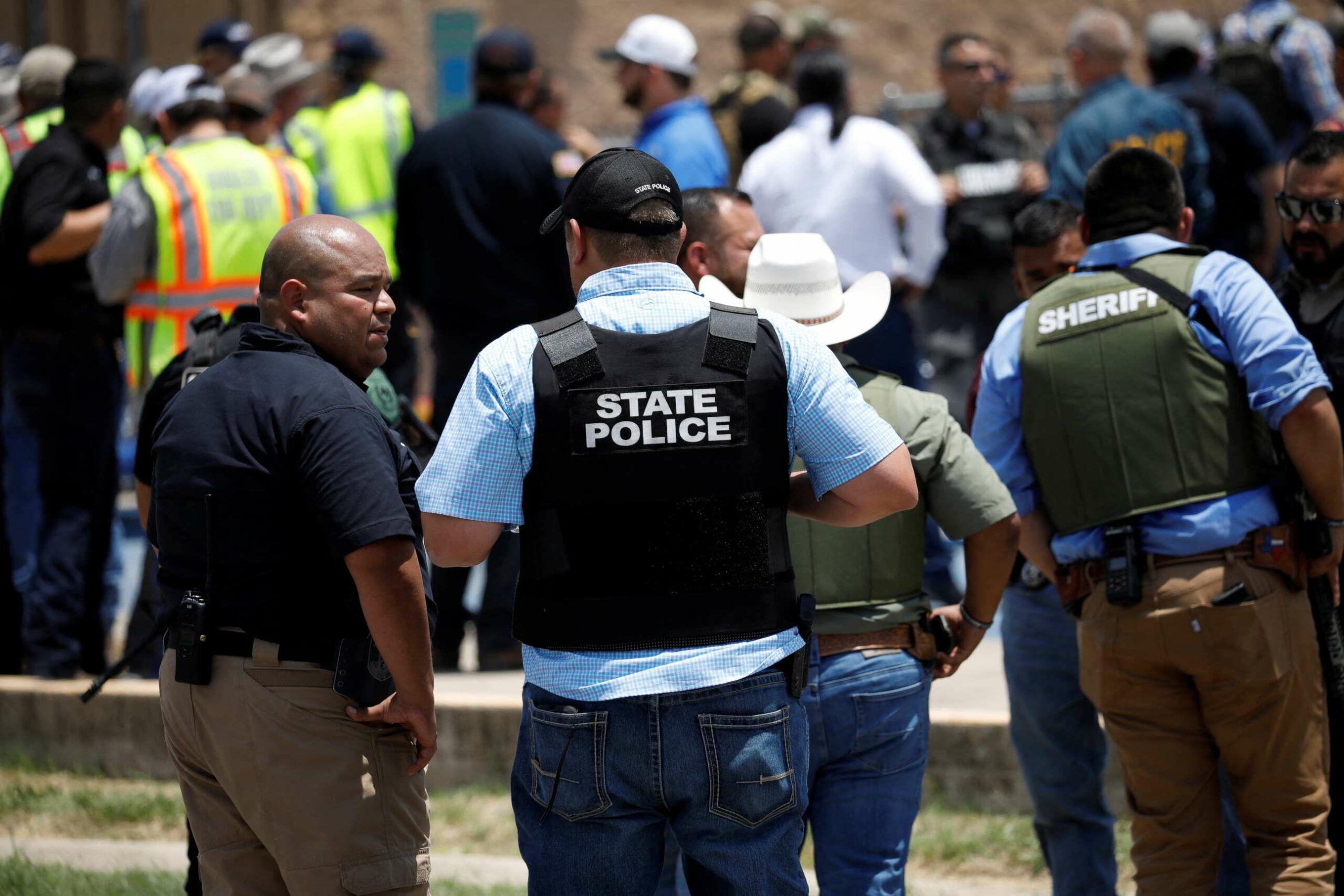 Near the Robb Elementary School in Uvalde, Texas, law enforcement personnel guard the scene of a possible shooting.