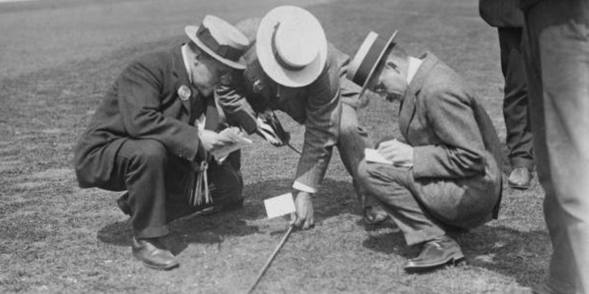 Officials Measuring the Javelin Throw